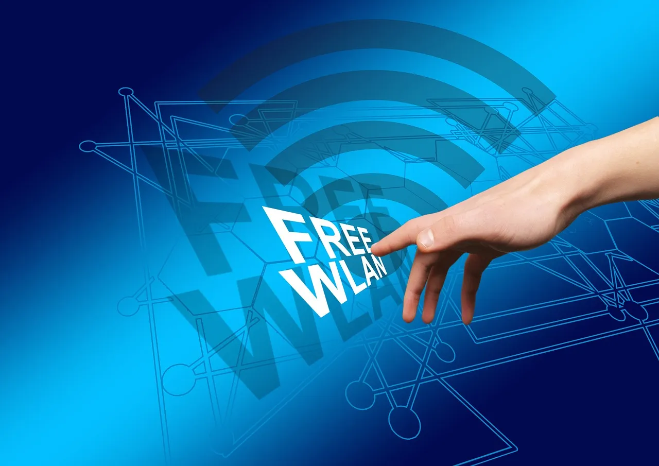 A hand touching a blue screen with a free Wi-Fi symbol