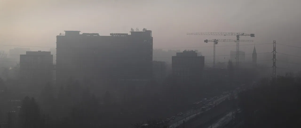 City buildings shrouded in gray smog