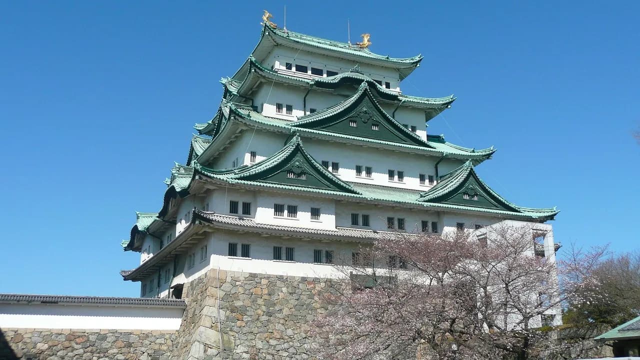 A traditional Japanese castle under a blue sky